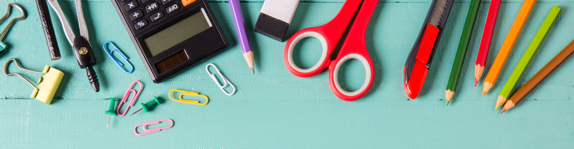 colored pencils, calculator, pen, clip, scissors